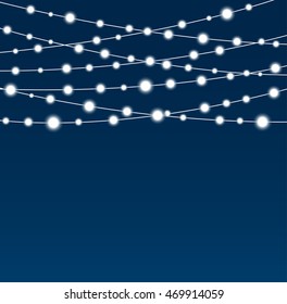 Holiday background with colorful glowing garland. Merry Christmas and New Year banner, poster, card. Festive festoon on blue background.
