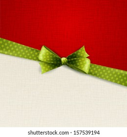 Holiday background with green polka dots ribbon and bow
