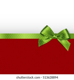 Holiday background with green polka dots bow. Christmas background