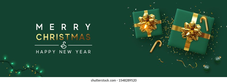 Holiday background Merry Christmas and Happy New Year. Xmas design with realistic festive objects, sparkling lights garland, green gift box, ball bauble, glitter gold confetti. Horizontal banner