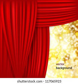 Holiday background with red satin and blurred lights.