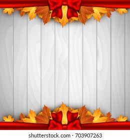 Holiday banner on wooden wall with autumn leaves and red bow. Autumn background. 