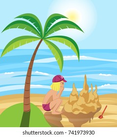 Holiday by the sea. A girl builds a Sand castle.