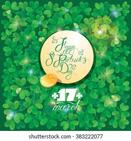 Holiday card with calligraphic words Happy St. Patrick`s Day in round frame and golden coin. Shamrock green background.