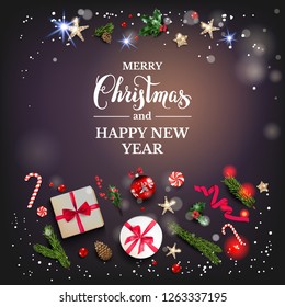 Holiday card with Christmas decorations and baubles, stars, gift boxes, fir tree branches on violet background. Christmas festive template.