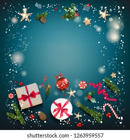 Holiday card with Christmas decorations and baubles, stars, gift boxes, fir tree branches on fairy blue background. Christmas festive template.