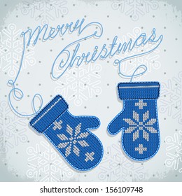 Holiday card design with knitted mittens.