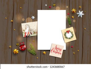 Holiday card with festive card and decorations balls, stars, snowflakes on wood background. Christmas festive template.
