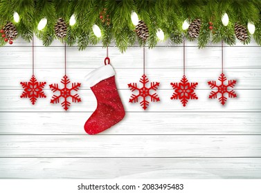 Holiday Christmas background with branch of tree, christmas snowflakes and a red socket. Vector