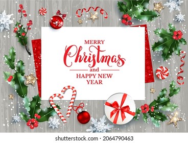 Holiday Christmas card with festive decorations stars, gift box, snowflakes, holly on wood background. Festive template for banner, ticket, leaflet, card, invitation, poster and so on