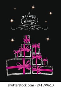 Holiday composition with silver shiny gift boxes and pink ribbons