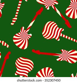 Holiday concept guitar silhouettes. Peppermint candy color guitar seamless pattern on green background. Vector illustration