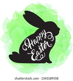 Holiday Easter background with black silhouette of rabbit on a green watercolor background. Vector illustration. 