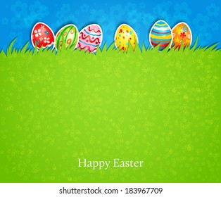 Holiday easter background. The colored eggs on the green grass