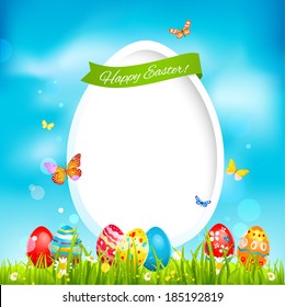 Holiday easter card with color eggs on green grass