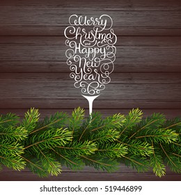 Holiday gift card with hand lettering Merry Christmas and Happy New Year in the form of a glass of champagne and borders from fir tree branches on wood background. Vector illustration for your design