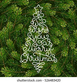 Holiday gift card with hand lettering We wish You a Merry Christmas in the form of a Christmas tree on fir tree branches background. Vector illustration for your design