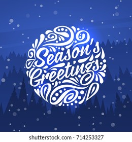 Holiday greeting card with typography on background of night forest. Seasons Greetings