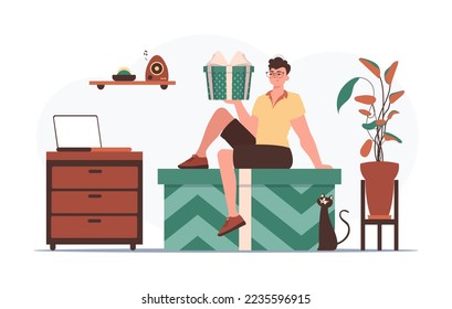 Holiday greetings concept. A man is holding a gift box.