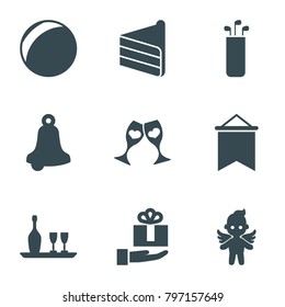 Holiday icons. set of 9 editable filled holiday icons such as bell, plastic ball, clink glasses, angel, gift on hand, wine bottle and glass, flag, golf putter