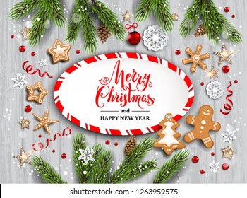 Holiday illustration with baubles, gingerbreads, stars, snowflakes on wood background. Christmas festive template with Christmas tree branches.