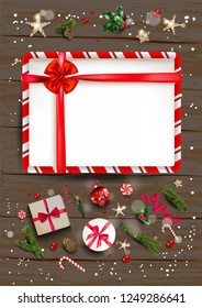 Holiday illustration with festive card and decorations balls, stars, snowflakes on wood background. Christmas festive template.