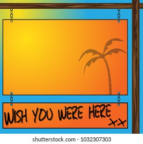 A Holiday Postcard Wish You Were Here Hanging Sign With Writing Space On A Sunny Background