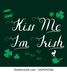 Holiday quote: Kiss me I'm Irish lettering. Saint Patrick's day Saying for greeting card with leprechaun hat, clover, coins and pipe