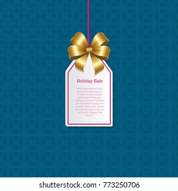 Holiday sale sign on small tag with shiny gold bow that hangs on thread with sample text isolated cartoon vector illustration on blue background.