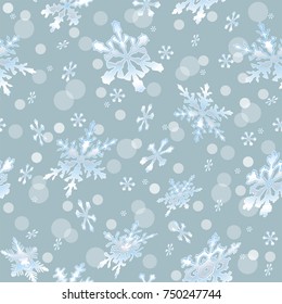 Holiday seamless background with frosty snowflakes on bluebackground