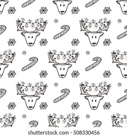 Holiday seamless pattern with Christmas reindeer and Christmas candy sticks. Hand drawn doodle vector illustration