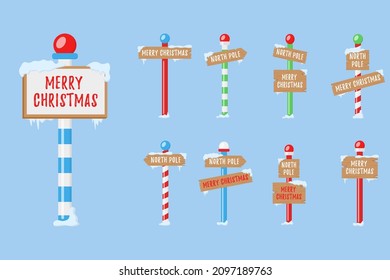 Holiday signs for the north pole. Set of wooden street signs in the snow, winter pointers in flat style. Winter holiday xmas symbol, cartoon banner. Vector illustration, eps 10.