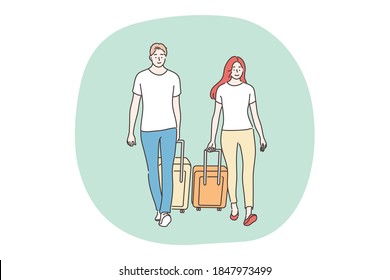 Holiday, travelling, tourism concept. Couple man woman boyfriend girlfriend travelers tourists walk with baggage luggage together. Travel abroad on vacation adventure lifestyle summertime recreation.