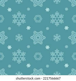 Holiday winter seamless pattern with many different white snowflakes for Christmas and New Year. Endless repeating pattern as wallpaper, fabric print, surface texture, package or gift paper.