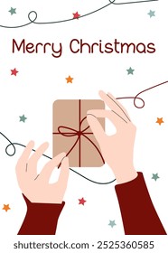 Envoltura de Festiva. Cerca de las manos que atan un arco en el regalo con fondo de Navidades. Tarjeta de felicitación con envoltura de regalo de Navidad. Tarjeta de Navidad