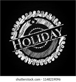 Holiday written on a chalkboard