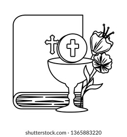 holy bible with chalice and flowers