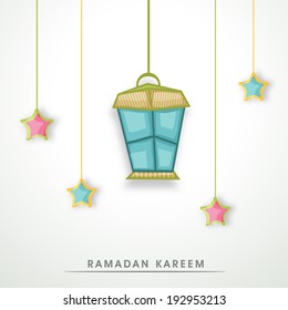 Holy month of muslim community festival Ramadan Kareem with hanging arabic lamp or lantern and colourful stars on grey background. 