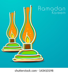 Holy month of Muslim community Ramadan Kareem background with illuminated tradition lanterns on blue.