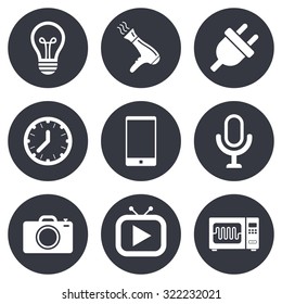 Home appliances, device icons. Electronics signs. Lamp, electrical plug and photo camera symbols. Gray flat circle buttons. Vector