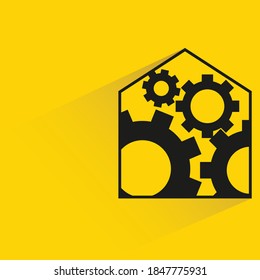 home and cogs with shadow yellow background