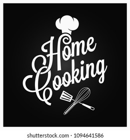 Home cooking vintage lettering with kitchen utensils on dark background