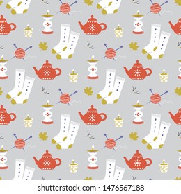 Home cozy seamless pattern. Cute vector illustration with knitting, tangle and spokes, socks, kettle, candlesticks
