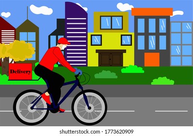 Home delivery. the man on a bicycle goes to make a delivery, respecting the new health standards and social distancing by wearing a face mask, Buildings and park in the background
