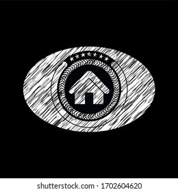 home icon inside chalkboard emblem. 
