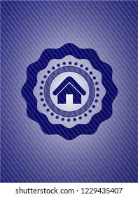 home icon inside emblem with denim texture