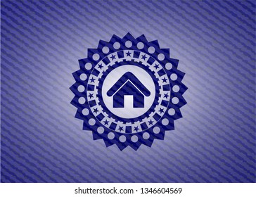home icon inside emblem with jean background