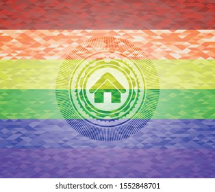 home icon inside emblem on mosaic background with the colors of the LGBT flag