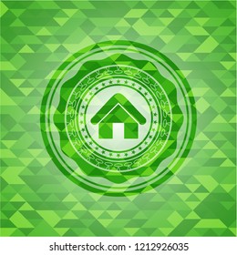 home icon inside green mosaic emblem