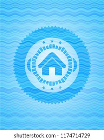 home icon inside light blue water wave badge background.